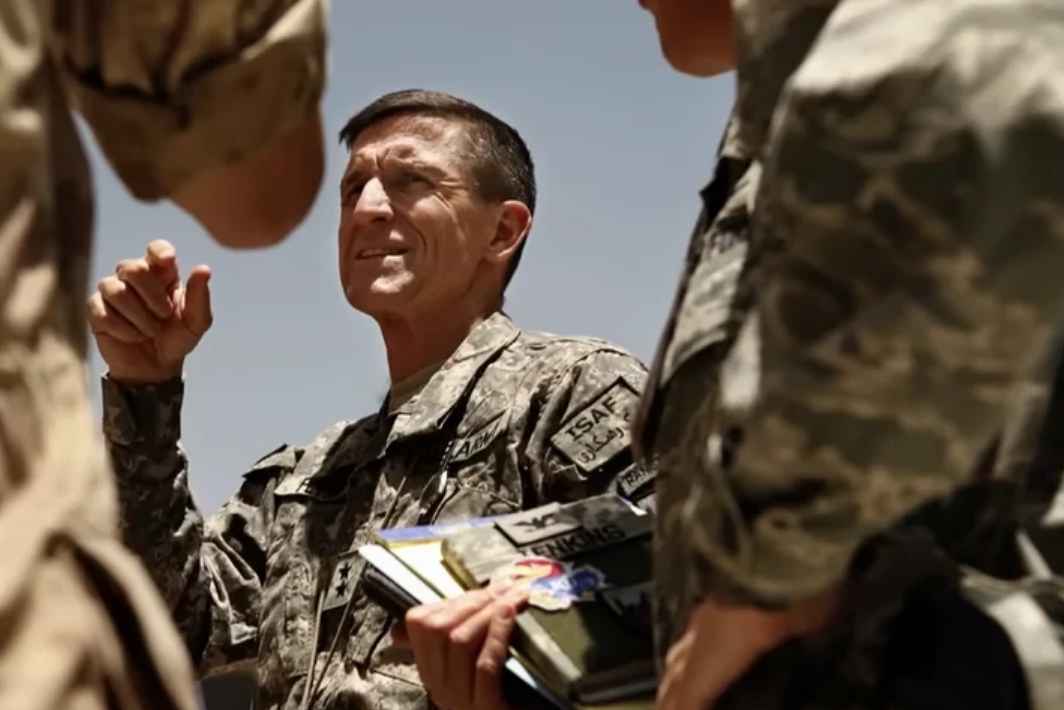 Military personnel in uniform having a discussion in a sunny outdoor setting
