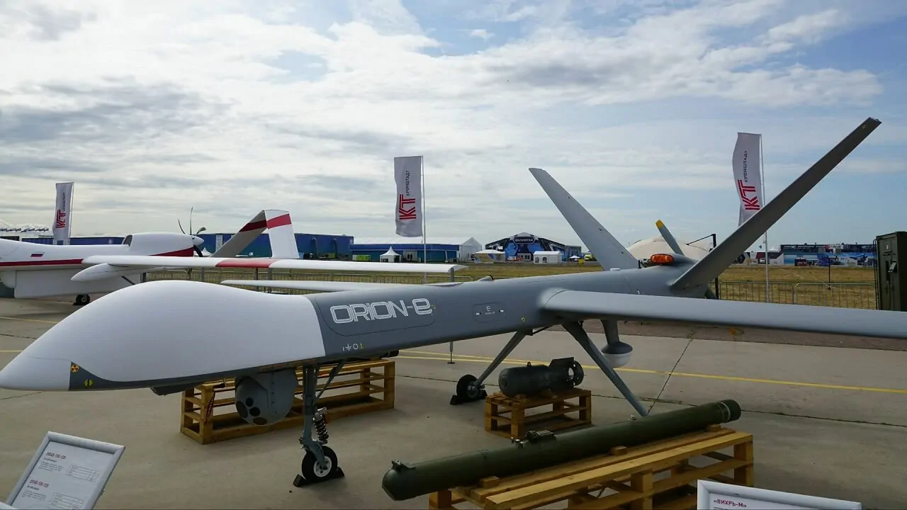 Kronshtadt Orion-E unmanned aerial vehicle (UAV) on display at an airshow, equipped with reconnaissance and combat payloads