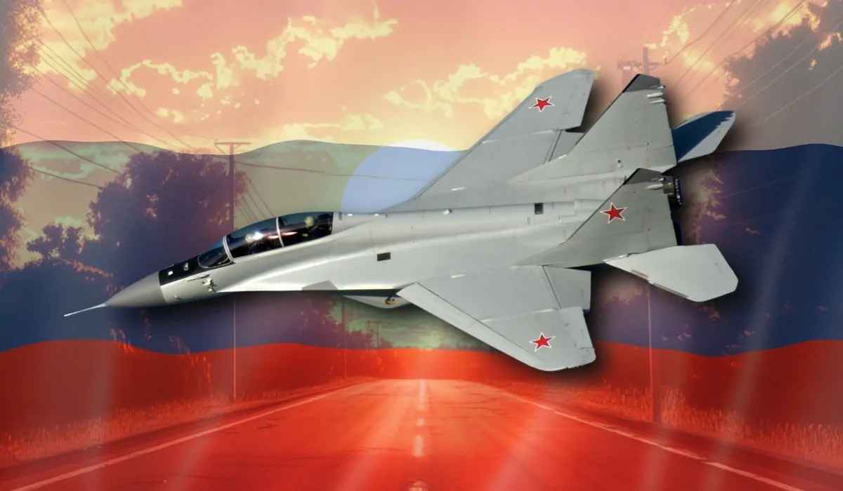 A Russian MiG-29 fighter jet soaring with the Russian flag in the background