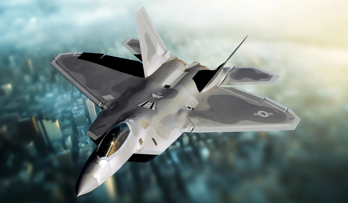 F-22A Raptor stealth fighter jet soaring above a city skyline
