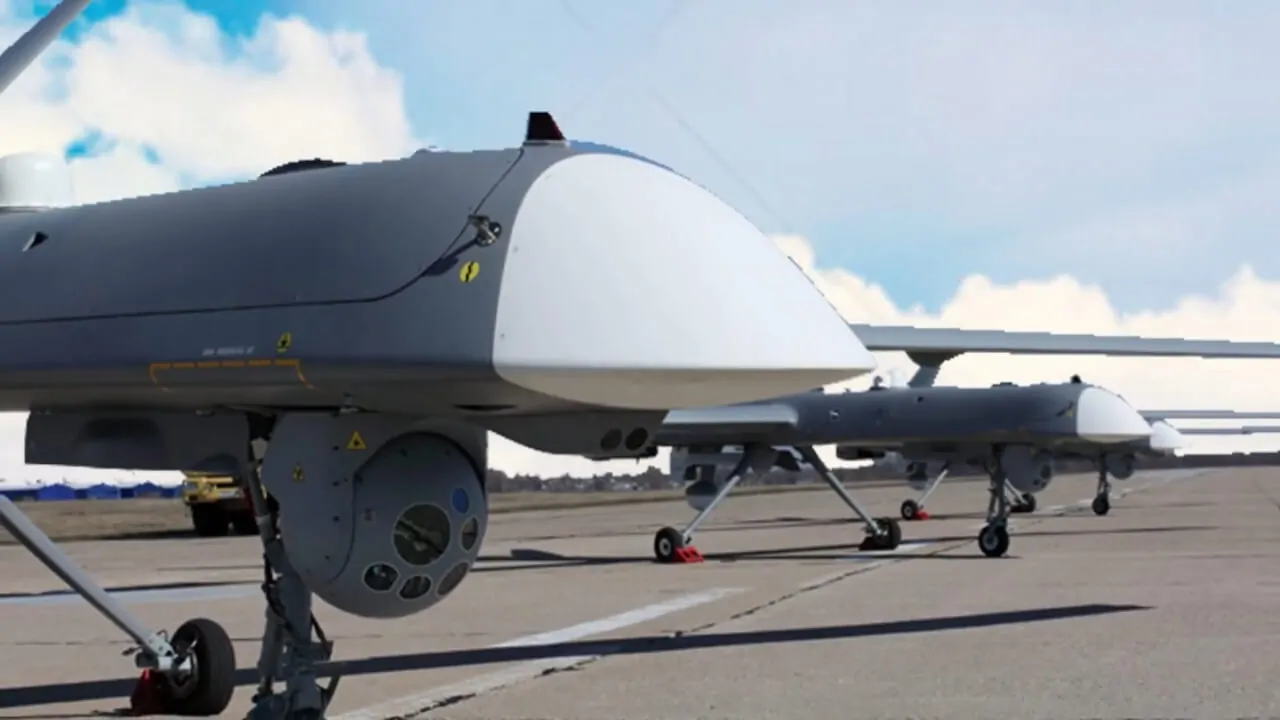 Close-up view of Kronshtadt Orion UAVs on the runway, highlighting advanced sensor modules and aerodynamic design