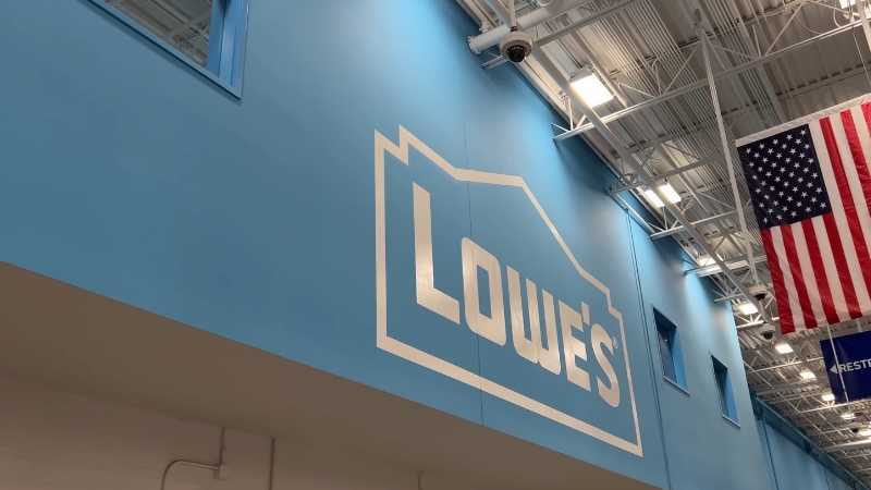 An American flag hangs inside a Lowe’s store where military families can use the Lowe military discount to save on purchases